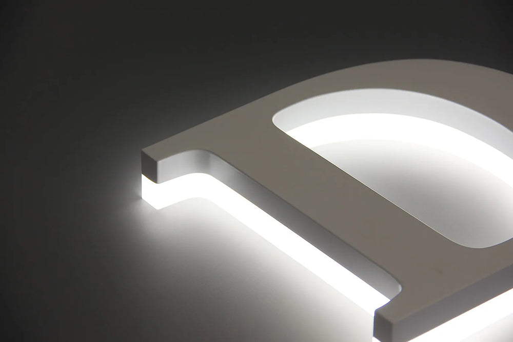 Side view of an illuminated fabricated letter, the kind of exterior sign most cities require a permit for
