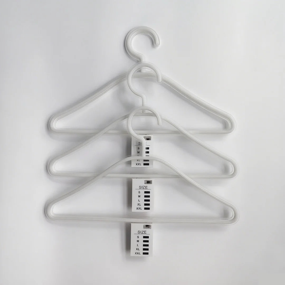 LED neon clothes hangers in pink, white, and warm-white colors, glowing around displayed white shirts in a stylish retail or closet setting, perfect for boutique lighting and fashion displays.