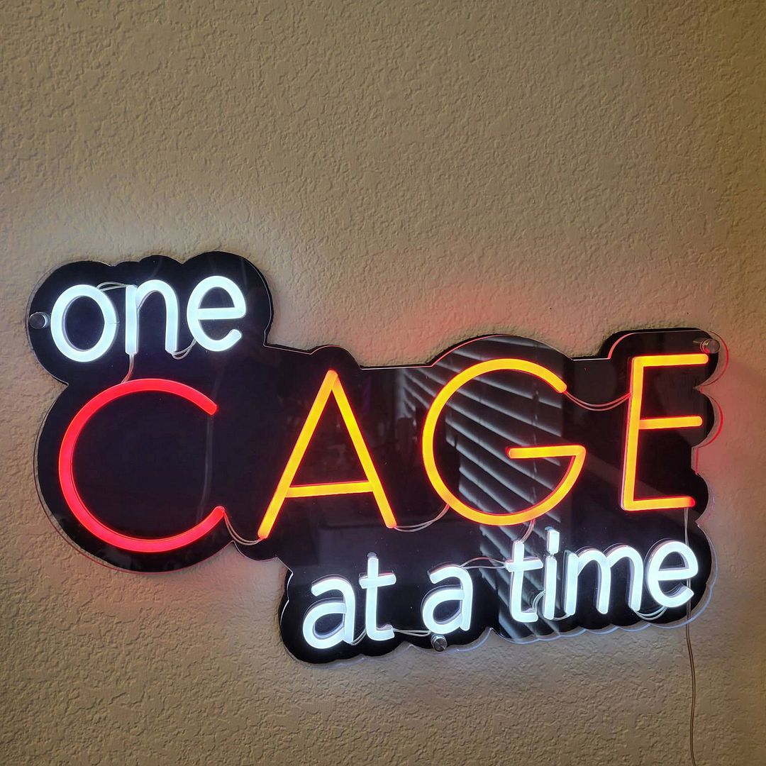One Cage at a Time Neon Sign