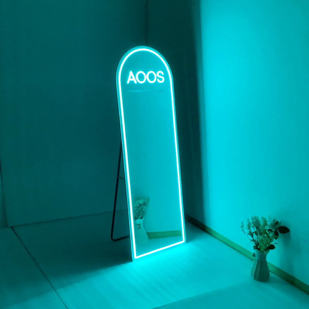 Free standing custom neon sign resting on the floor at an event