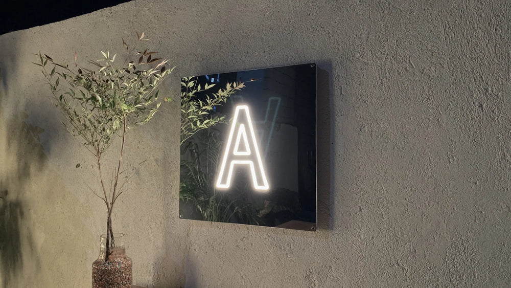 Hand drawn monogram turned into a bent custom neon sign