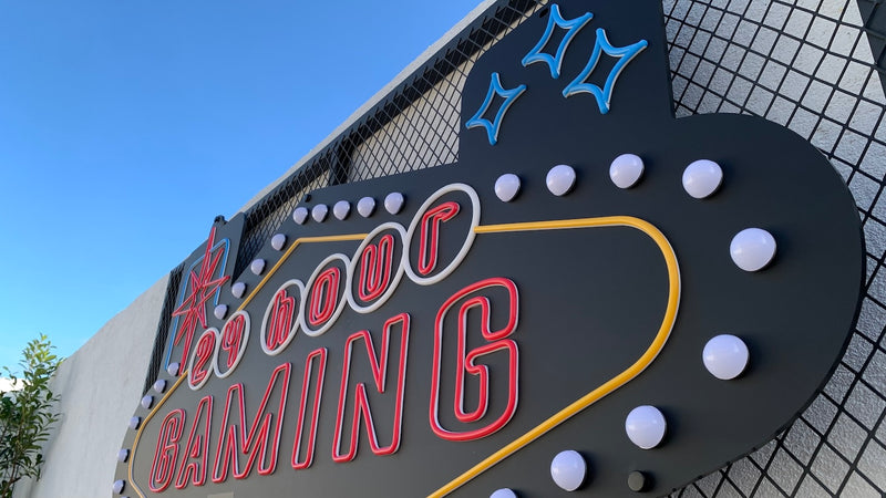 Custom marquee channel letter storefront sign installed on an exterior wall