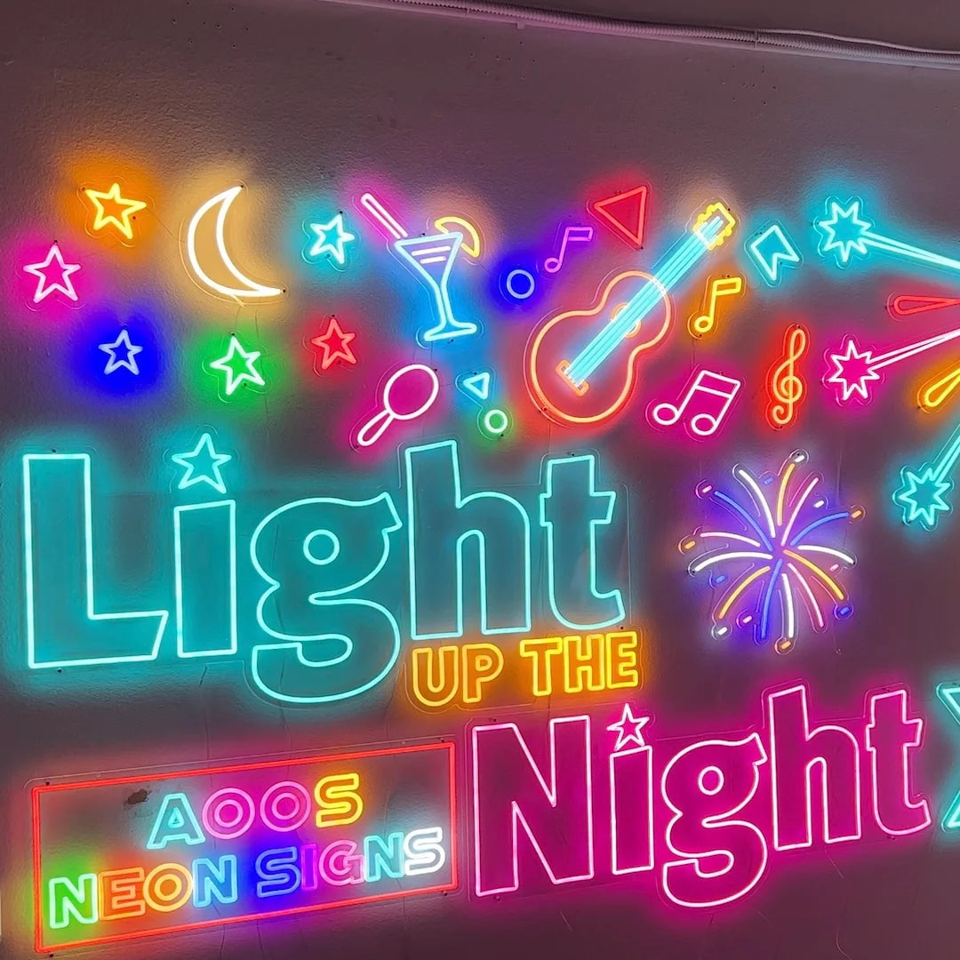 Custom motion LED neon sign with “Light Up The Night” text and colorful music, star, and party icons on a wall