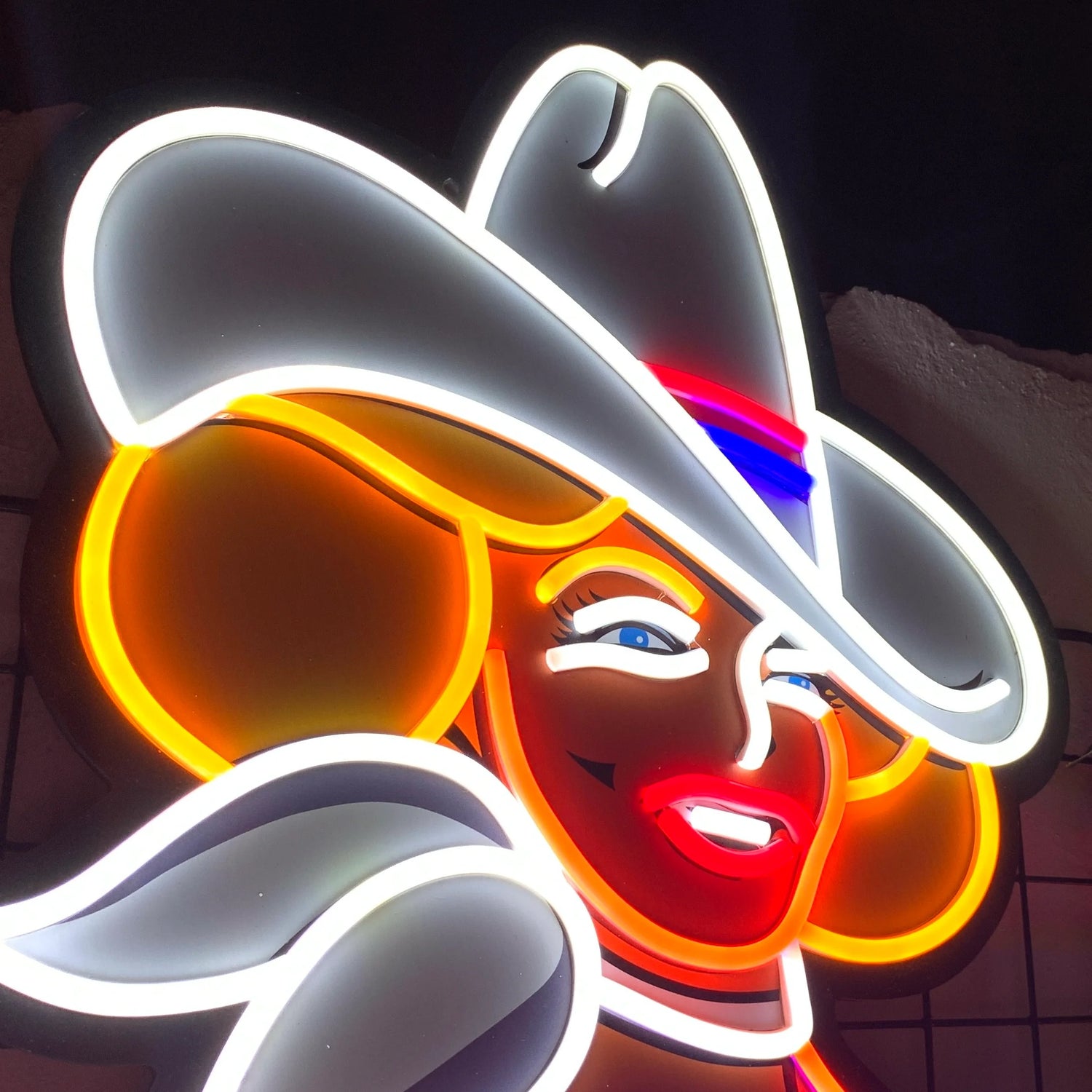 Custom Western-themed neon sign featuring a cowgirl in boots and hat, styled as a vintage LED wall display for cowboy bars or rustic Americana-themed interiors.