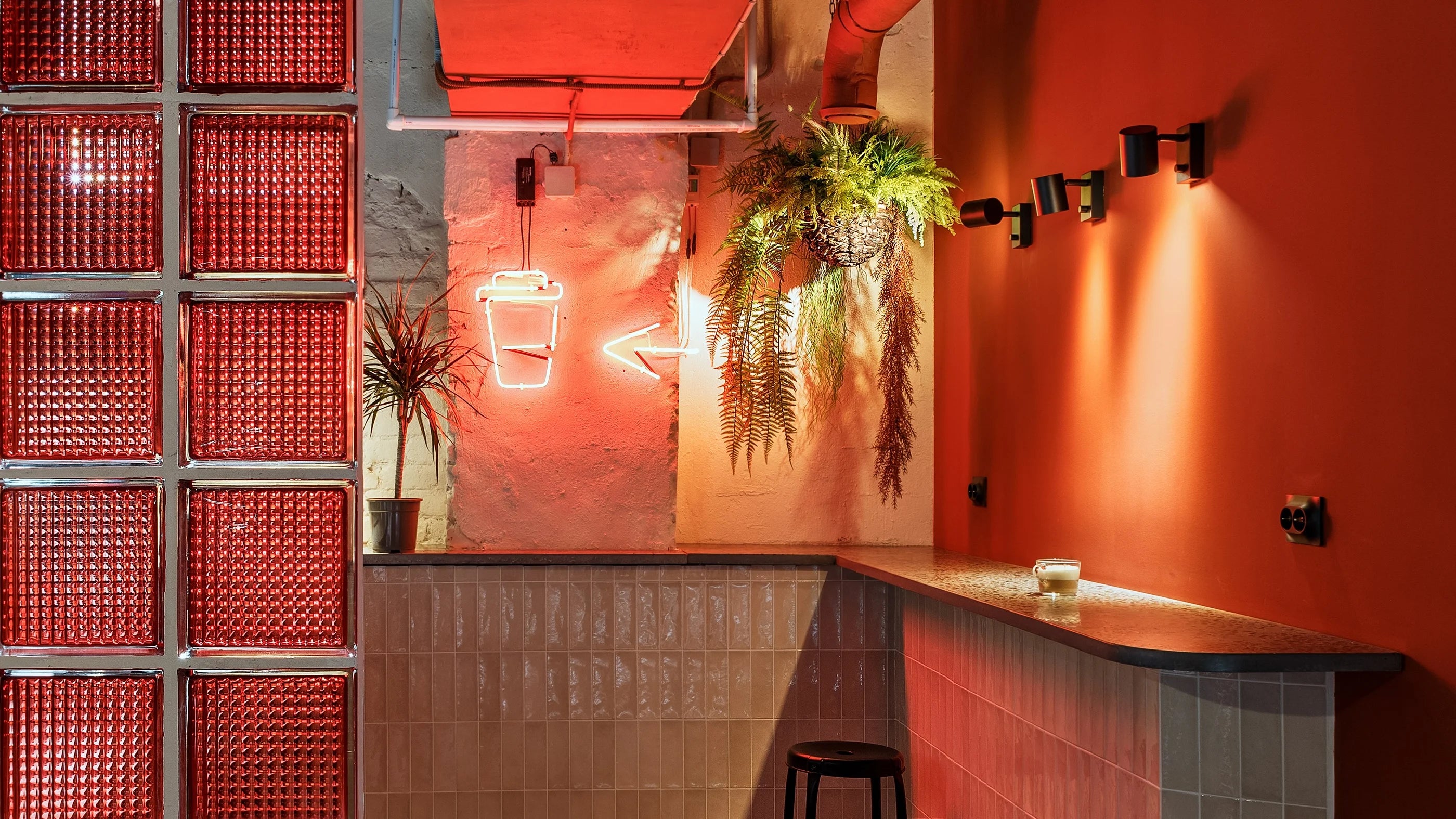 Custom LED flex neon sign with personalized text or logo made from flexible LED neon tubing. The sign uses colored silicone neon strips mounted on a clear acrylic backing panel for wall installation. The design can include script lettering, block text, or logo outlines with evenly diffused LED illumination. The sign is suitable for storefront branding, salon signs, bar signs, event signage, retail displays, and interior business walls.