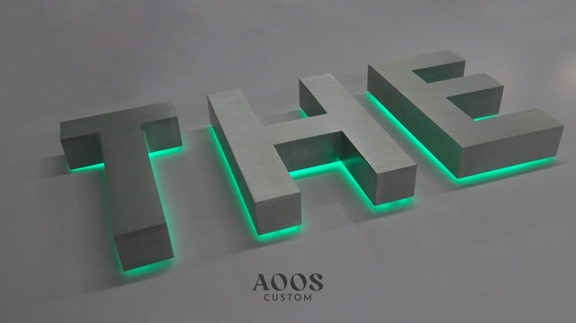 Halo lit channel letters, illuminated metal storefront sign lit from behind