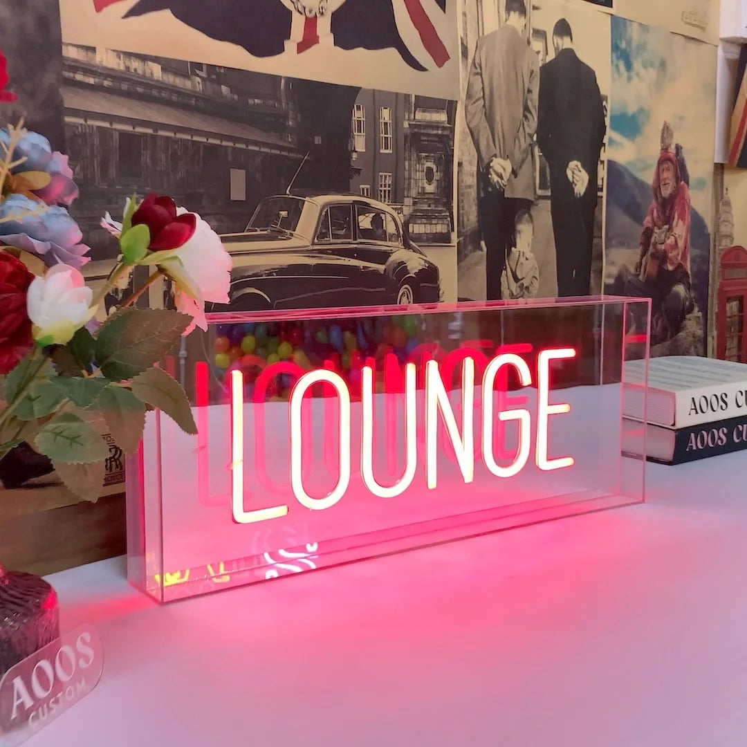 Custom LED neon box sign with illuminated Lounge lettering inside a clear acrylic case for tabletop bar or reception display
