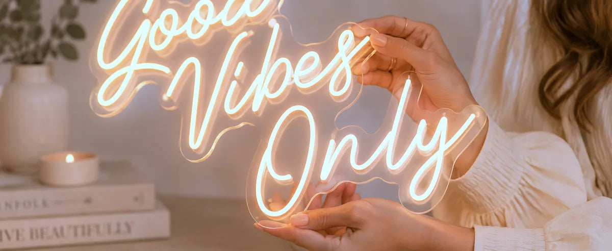 Good Vibes Only custom LED neon sign held in two hands, showing its real size