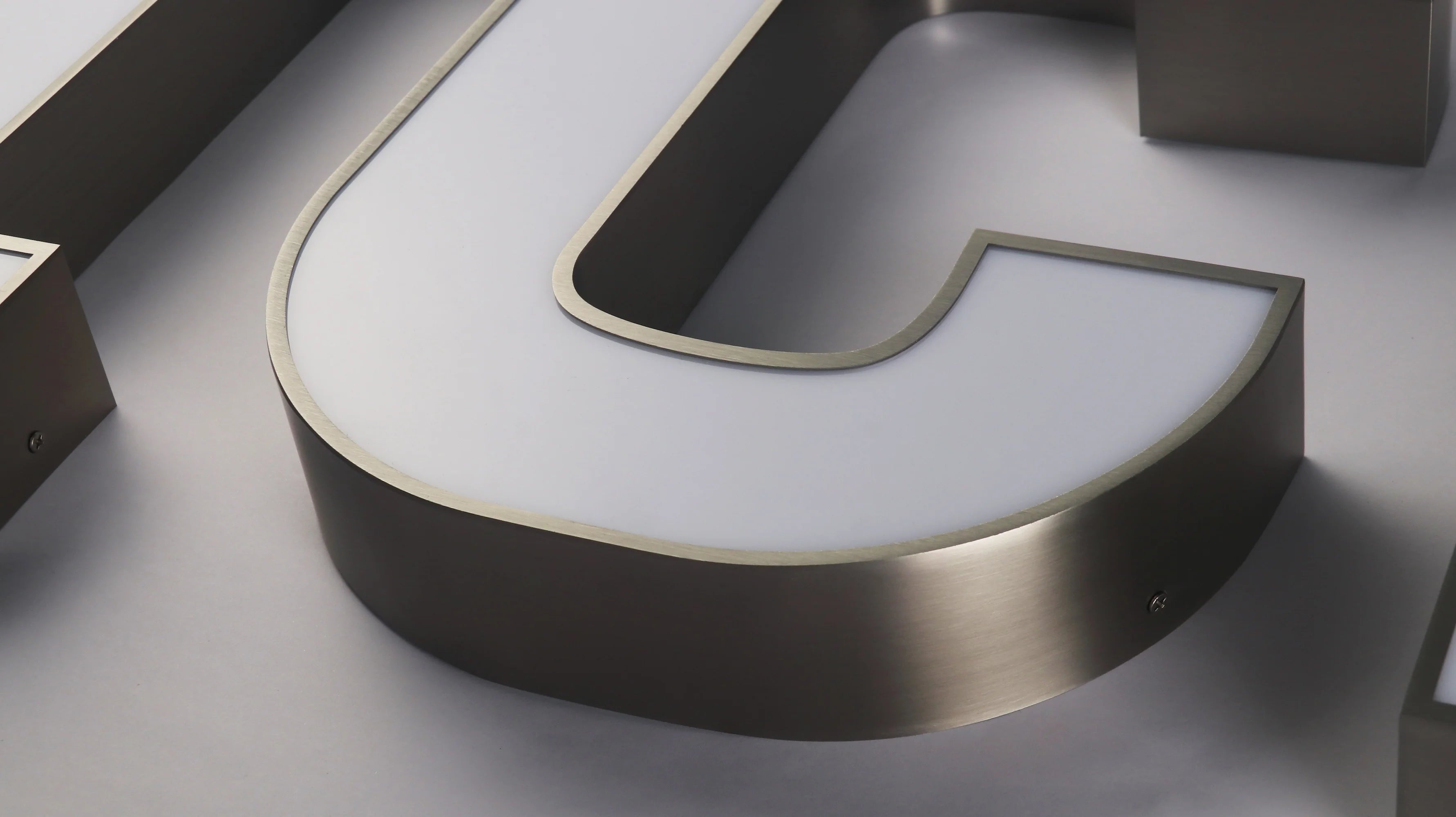 Premium 304 stainless steel front-lit letters with a durable metal structure, bright face illumination, corrosion-resistant materials, and a solid construction designed for long-term indoor and outdoor signage use.