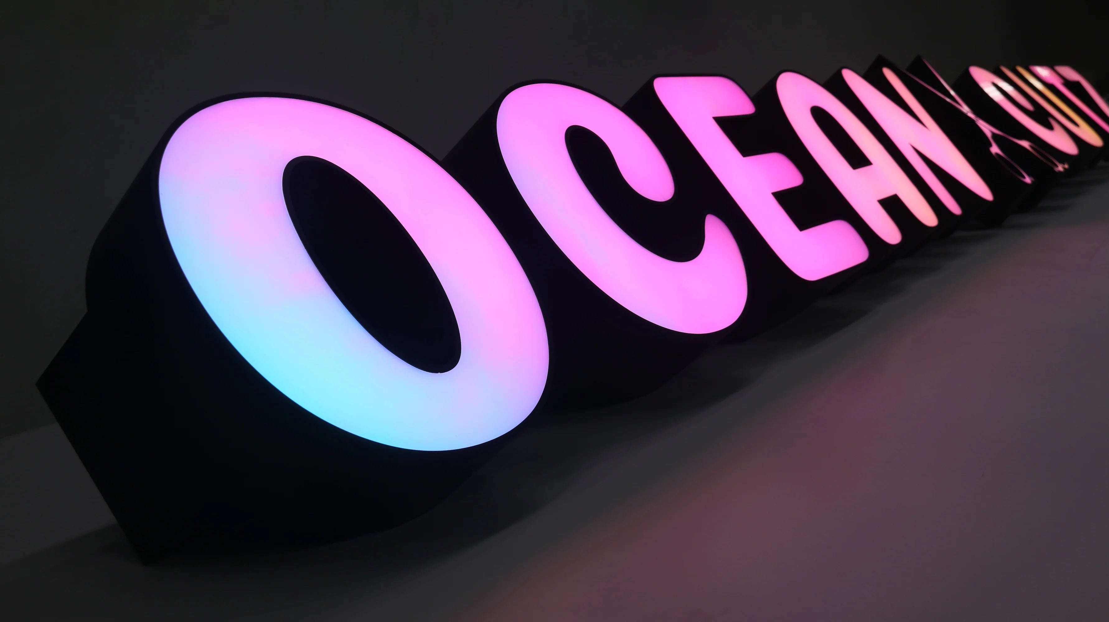 Custom front-lit letters with adjustable LED lighting colors, animated illumination modes, gradient color transitions, and dynamic lighting effects designed to create an eye-catching commercial sign display.
