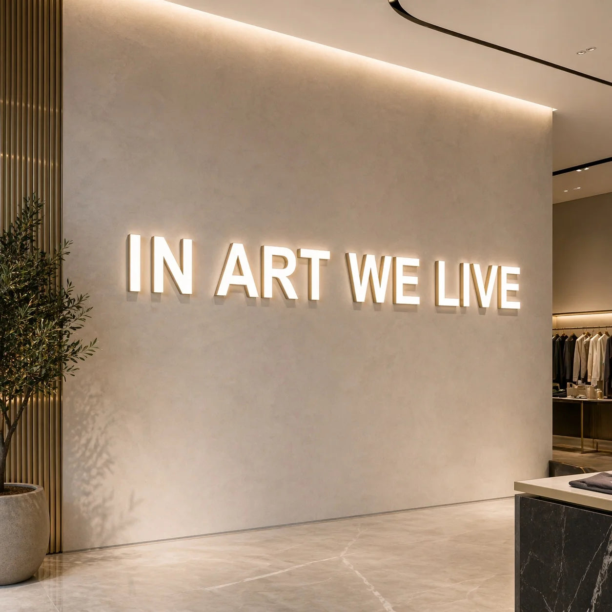 Custom trimless front-lit channel letters installed on a luxury brand background wall, featuring bright white illuminated acrylic faces with champagne gold metal sides and a refined 3D built-up profile. The sign is mounted on a smooth light beige textured interior wall, creating a clean and upscale brand statement display. Soft, even front illumination highlights the letterforms while subtle halo reflections enhance the premium look.