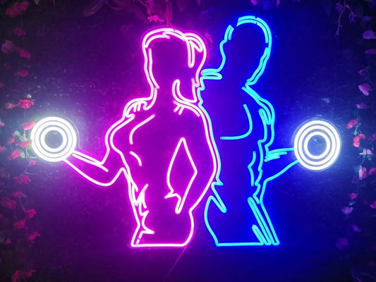 Man and Woman Training with Dumbbells Neon Sign