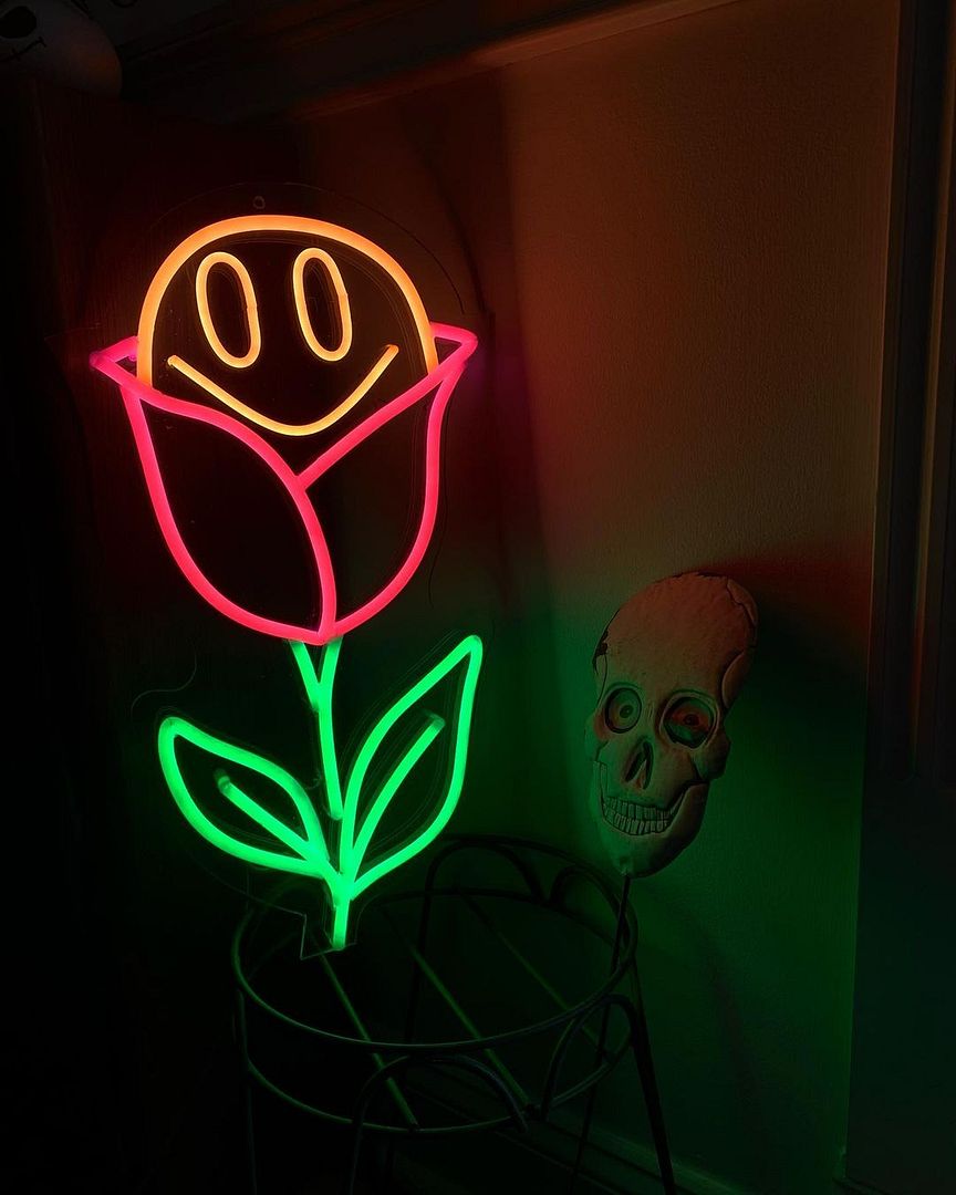Smiley Face in a Rose Neon Sign